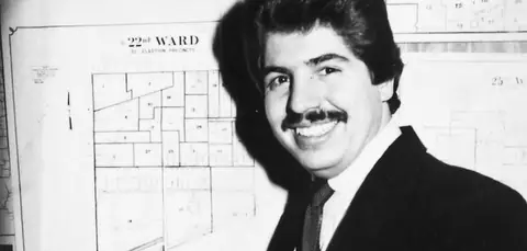 Rudy Lozano in front of a 22nd Ward precinct map